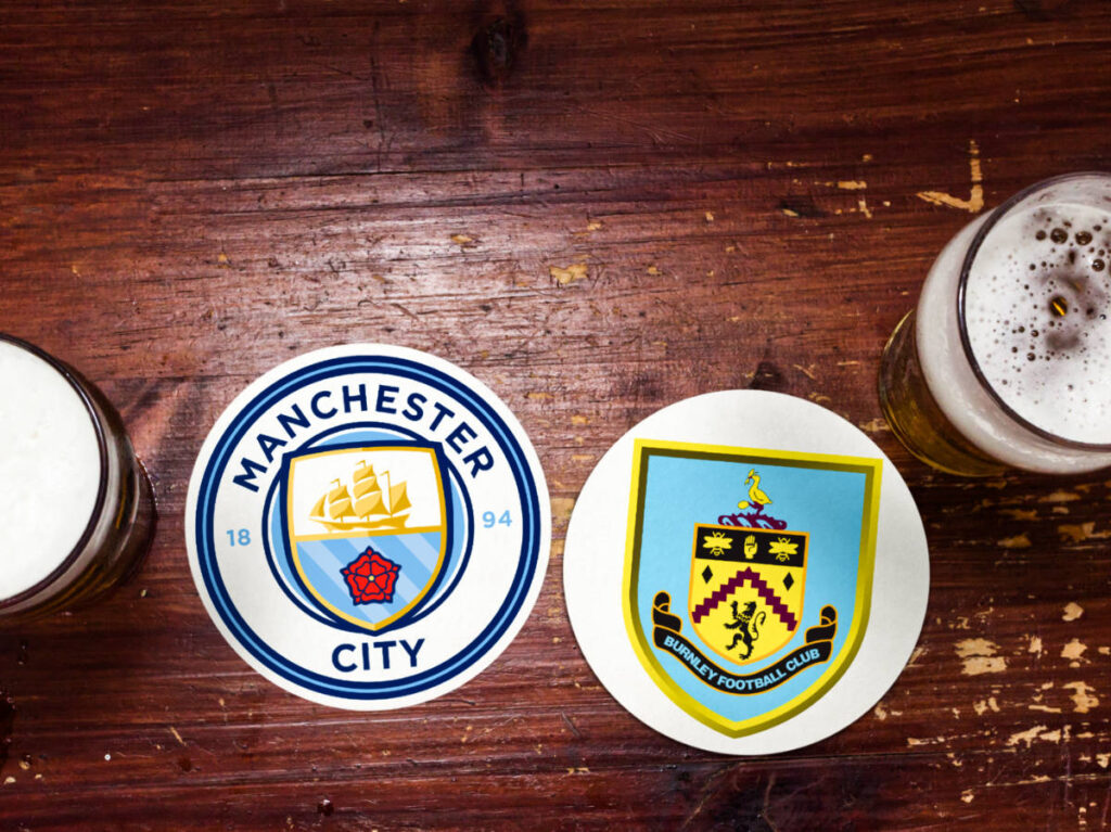 Pints of beer covered with the logo of Manchester and Burnley football team