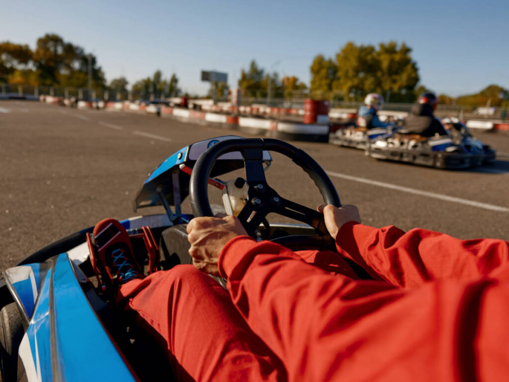 Closeup look of the go-kart driver's hand