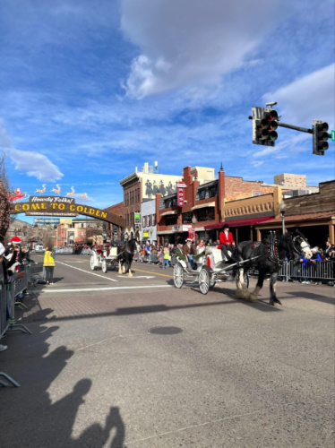 The horse carriages with the Golden arch sign in the background