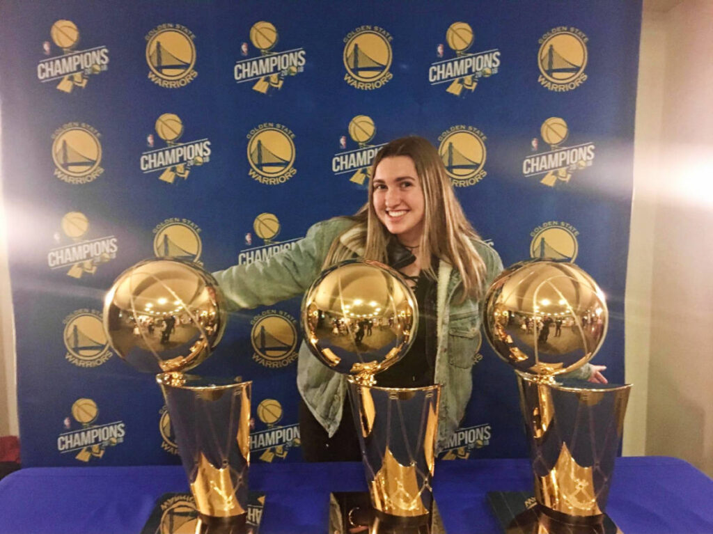 The author, Laura McFarland with the trophies of Golden State Warriors
