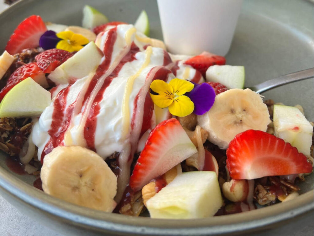 A bowl with granola and fruits at Partisan