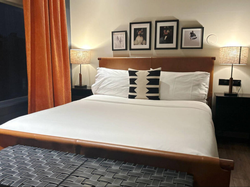 The huge bed and interior of the hotel room in Gravity Haus Denver