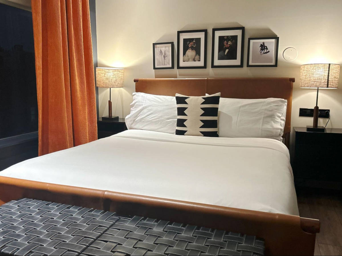 The huge bed and interior of the hotel room in Gravity Haus Denver