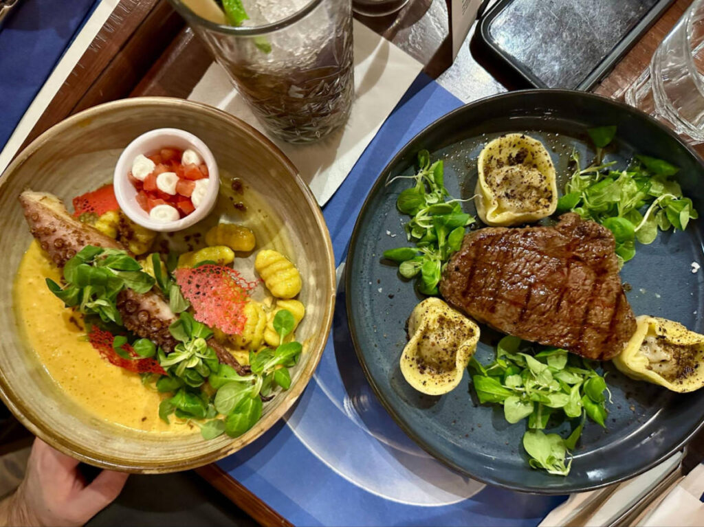 Closeup look of the grilled octopus and beef rump steak from Bruxx