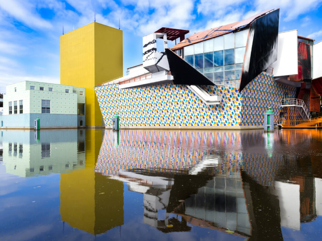 The modern architecture of Groninger Museum reflecting on the water