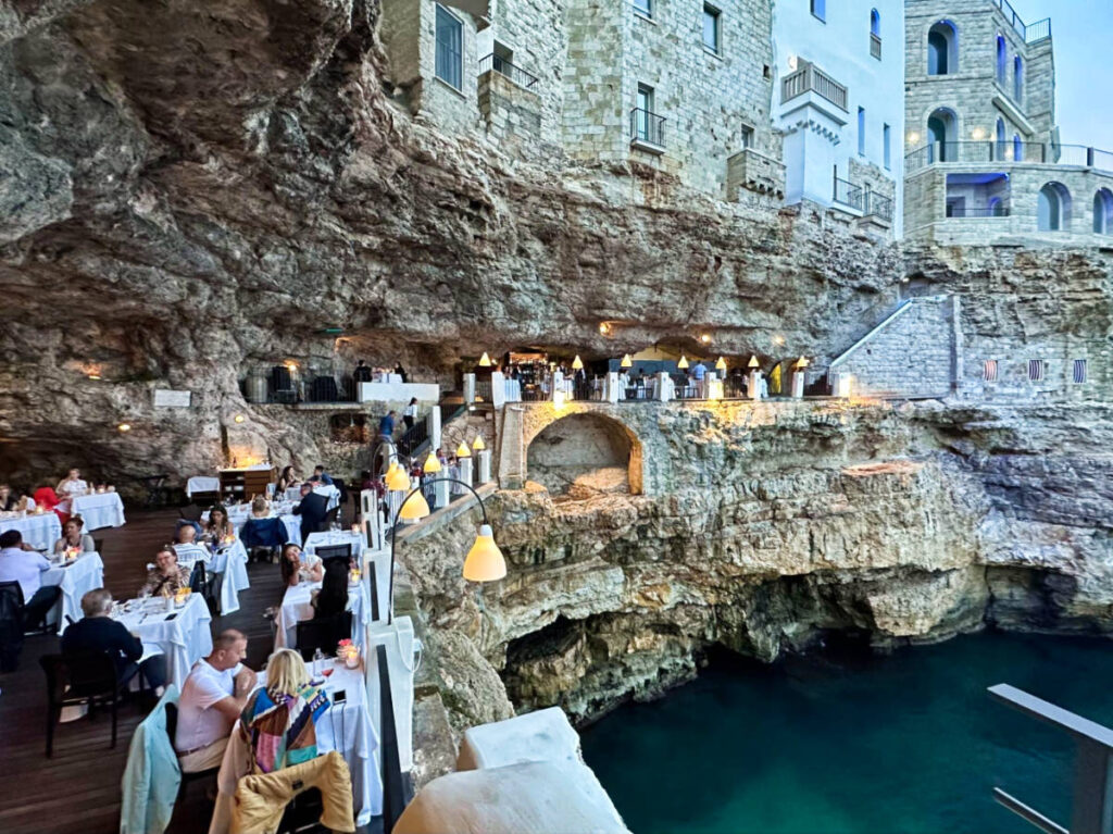 Panoramic view of the beautiful dining terrace in the natural cliff in Italy