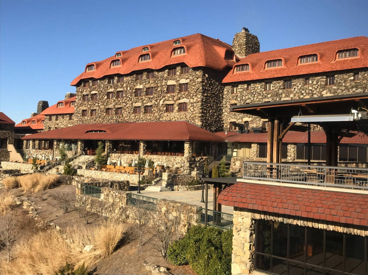 View of the grounds in front of the building of Omni Grove Park Inn in winter