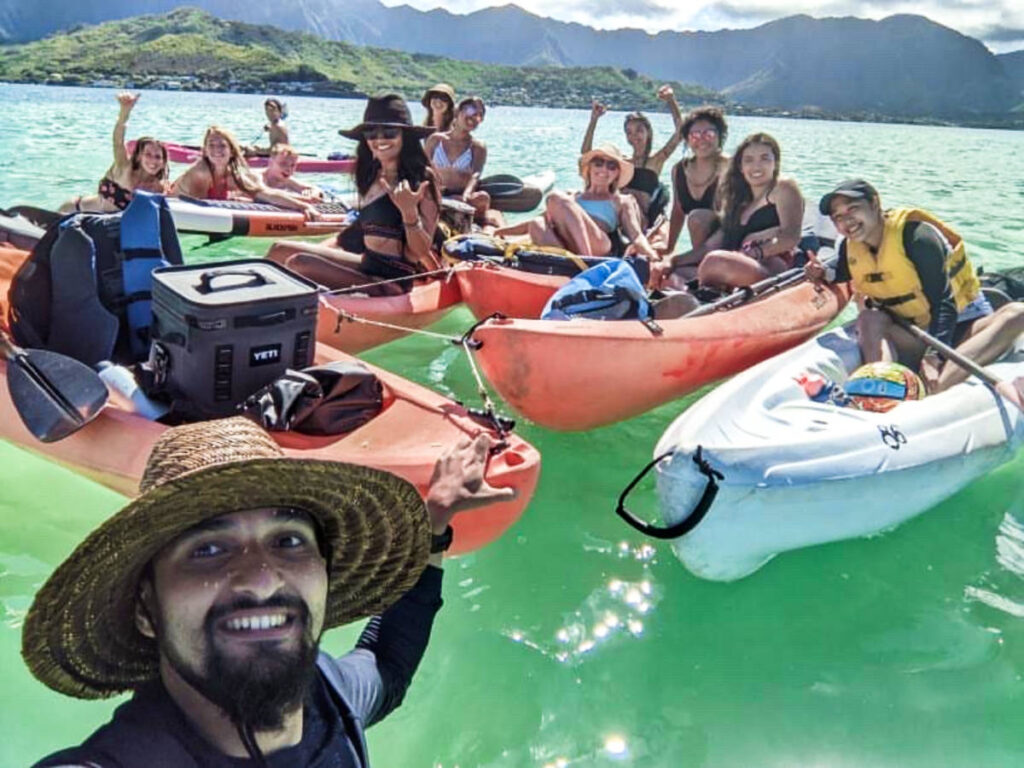 A group of friends enjoying at the Kaneohe Sandbar
