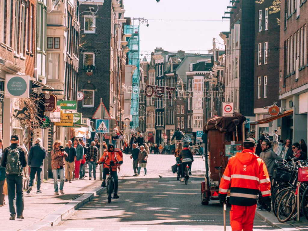 People walking along the streets of Haarlemmerdijk