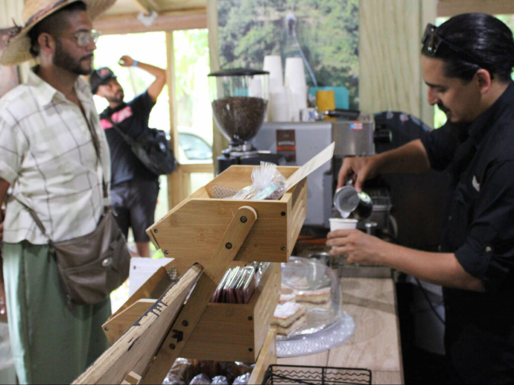 A man mixing a drink at the Hacienda Café del Alba