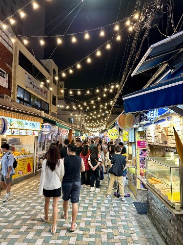 People walking and shopping at Haeundae Market