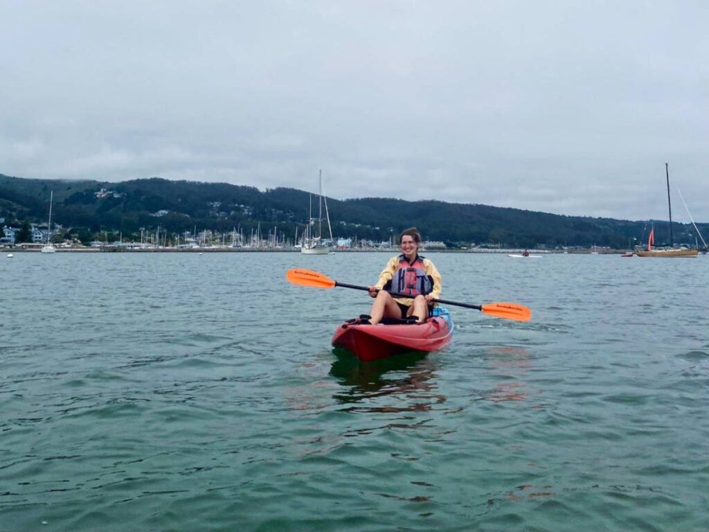 The author, Laura McFarland kayaking on Half Moon Bay