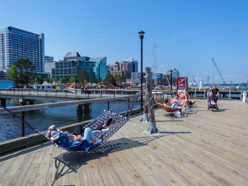 People relaxing on a sunny day at Halifax Harbourfront