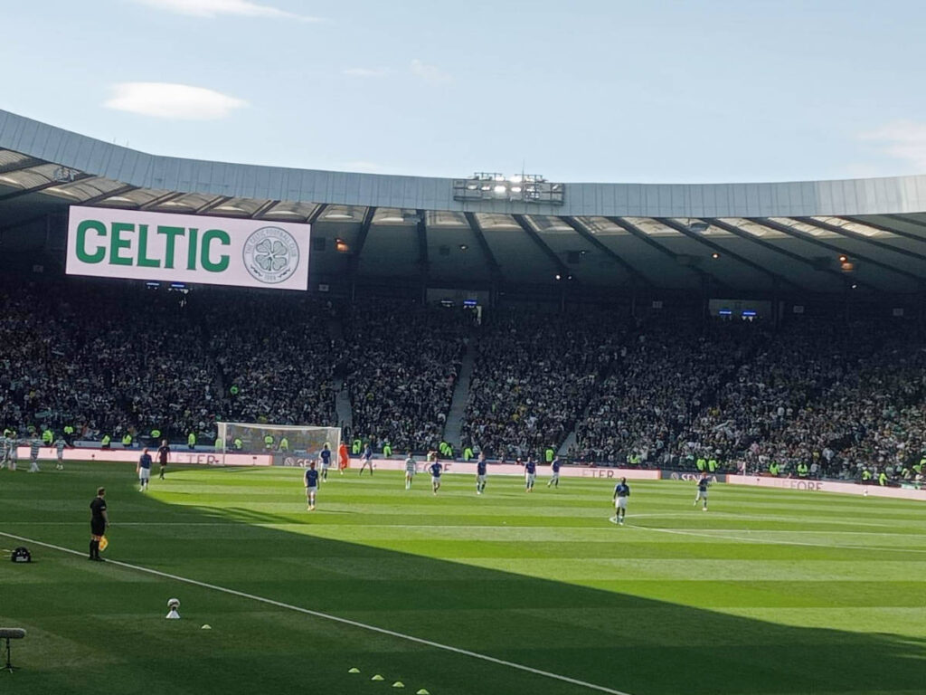 Players on the field during a football match at Hampden in Glasgow