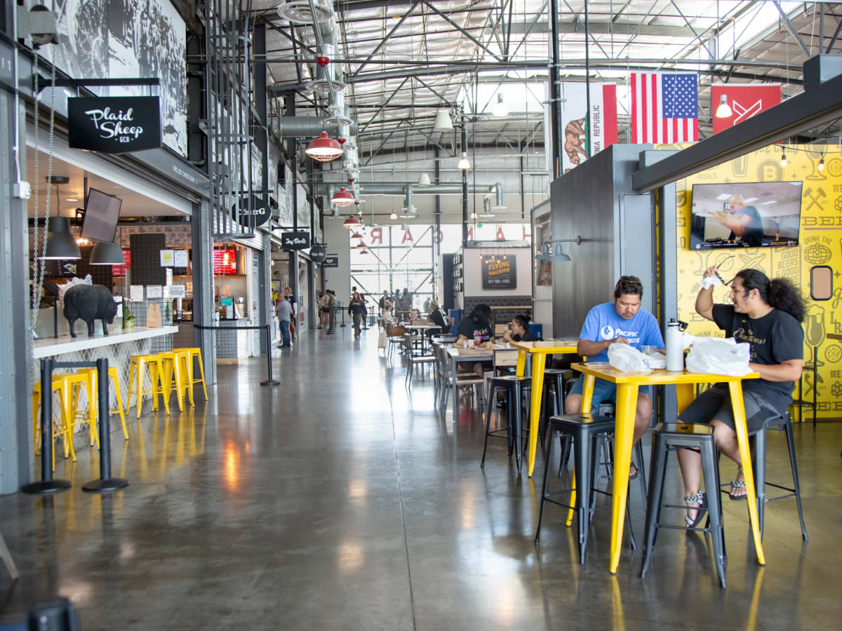 People enjoying their lunch in Long Beach Exchange