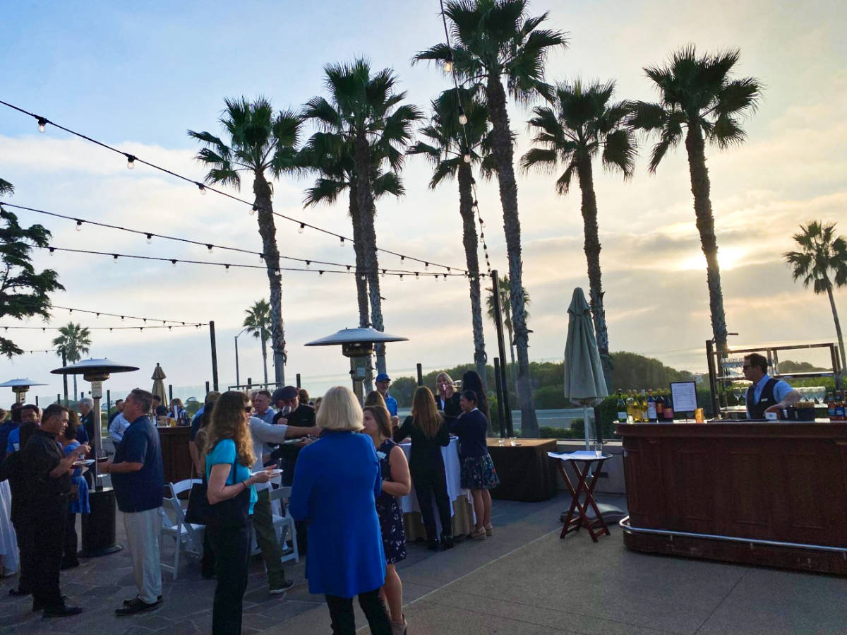 people drinking during the happy hour at sunset