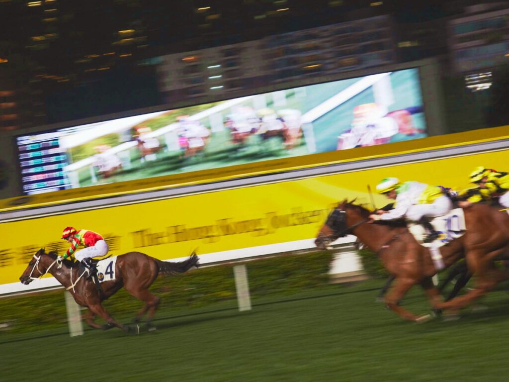 View of horses racing at Happy Valley Racecourse