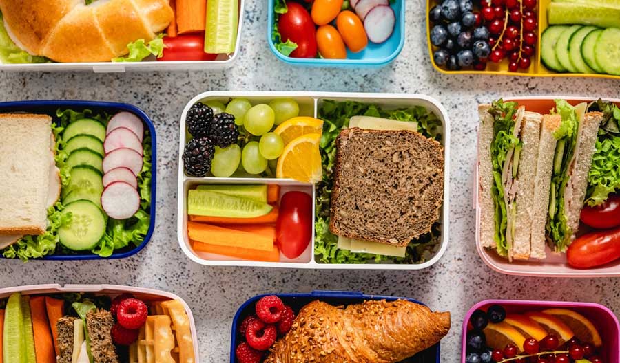 A colorful and healthy foods on lunchboxes