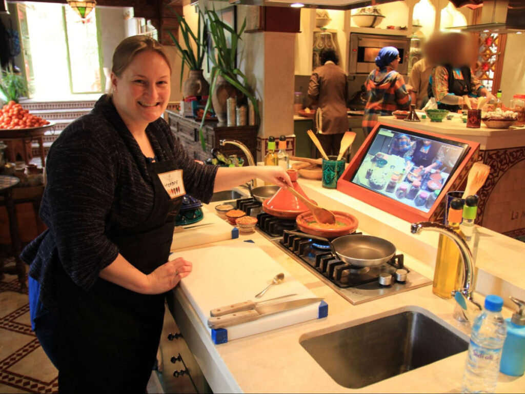 The author Heather Cole, learning to cook tagine at La Maison Arabe