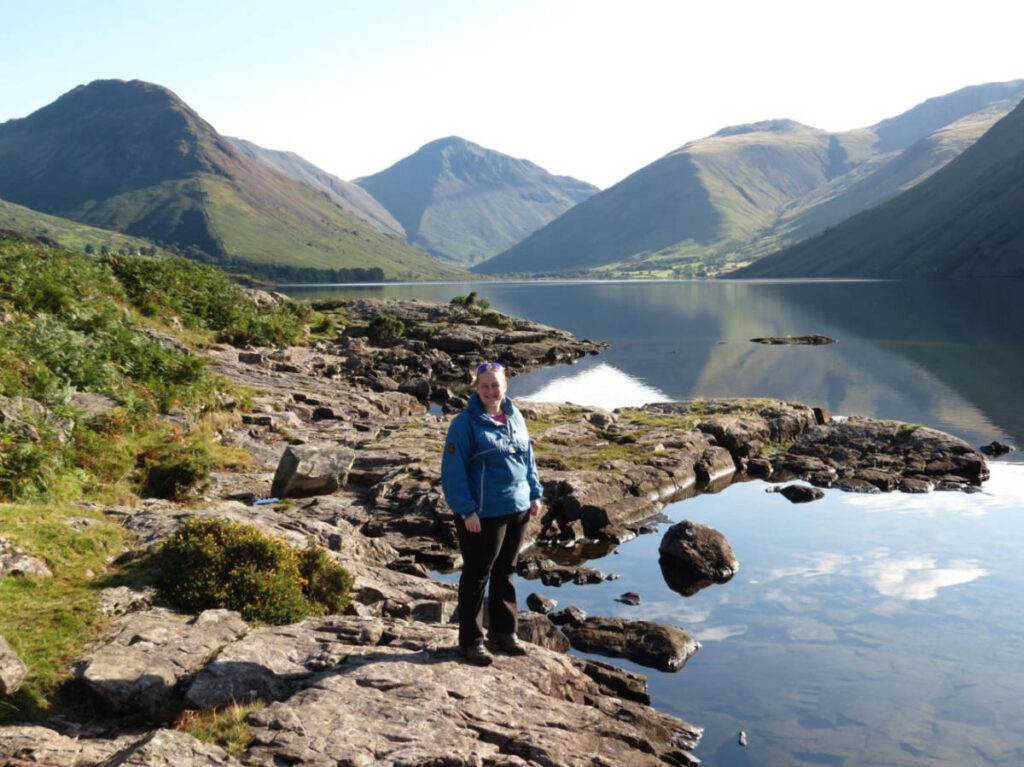 The author Heather Cole, standing with the scenic mountain views at Wastwater