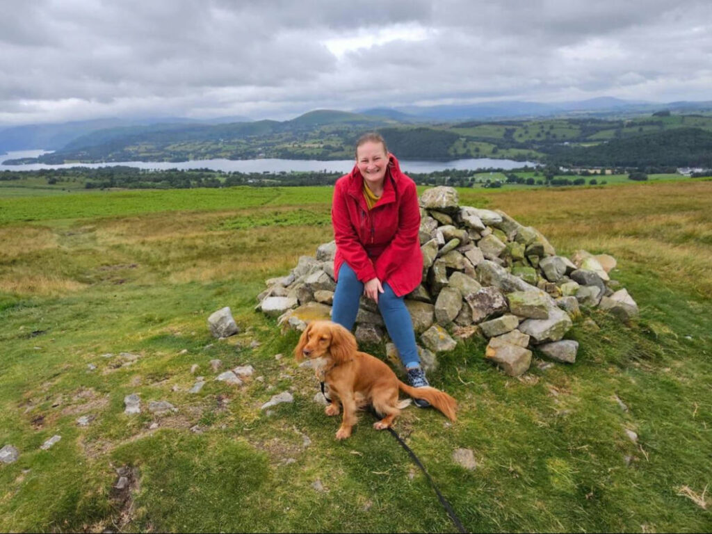 The author Heather Cole, wearing a raincoat at Ullswater