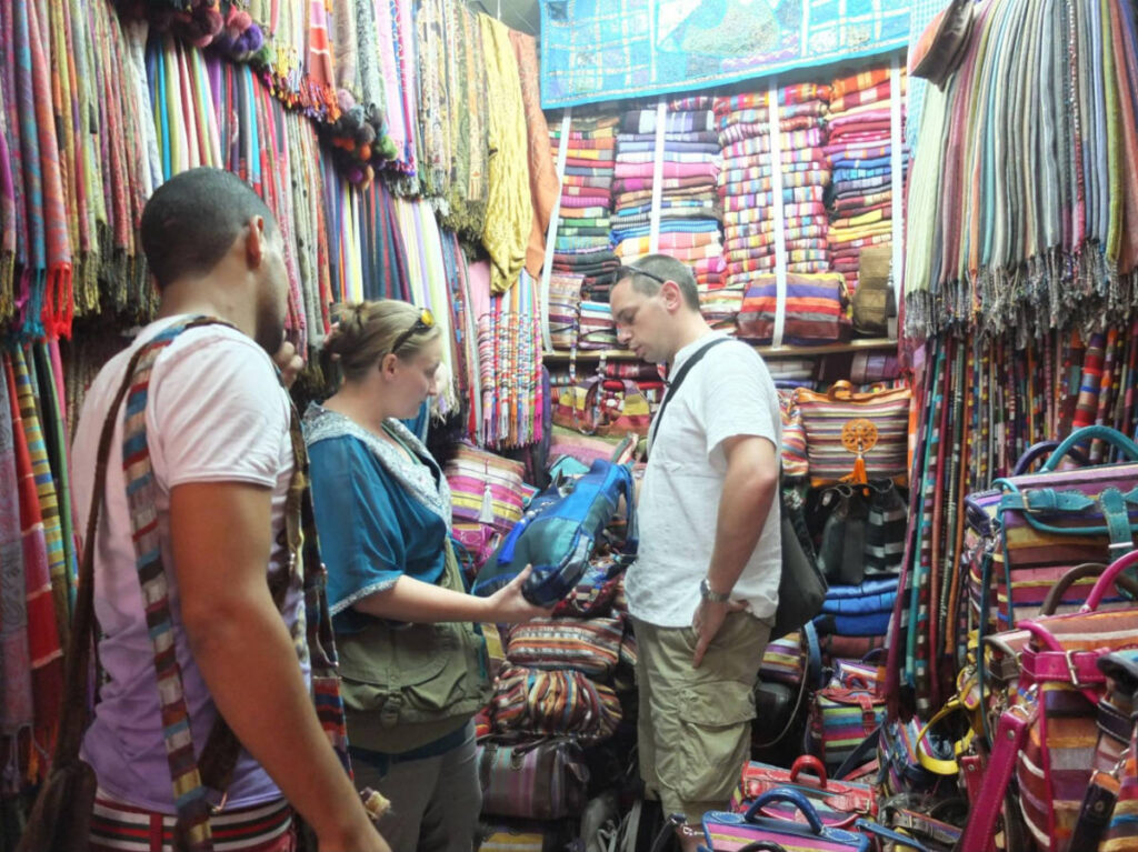 The author Heather Cole and her husband, haggling in a local store in Marrakesh