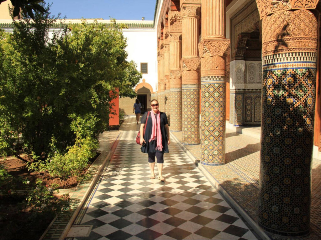 The author Heather Cole, walking along the pathway surrounded by the beautiful architecture in the Confluences Museum
