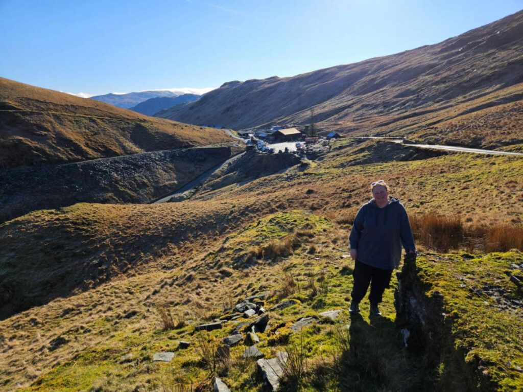 The author Heather Cole, smiling for a photo at the Honister Slate Mine