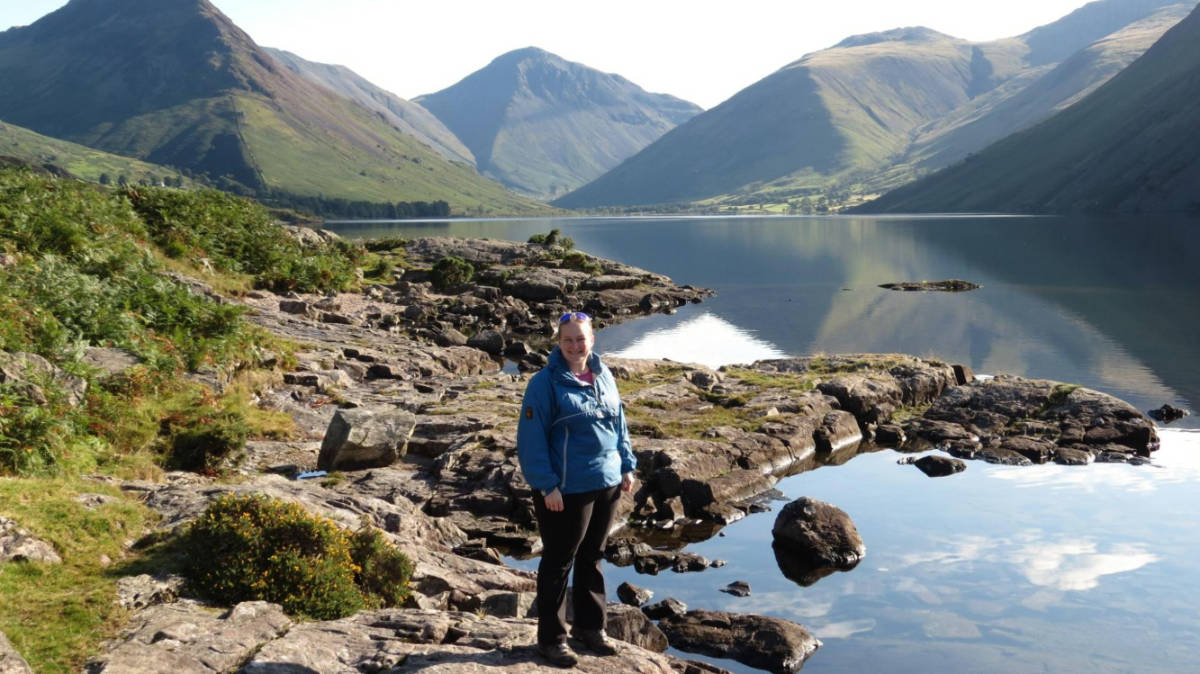 The author Heather Cole, standing with the scenic mountain views at Wastwater
