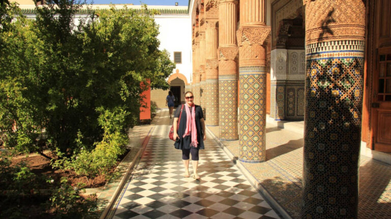 The author Heather Cole, walking along the pathway surrounded by the beautiful architecture in the Confluences Museum