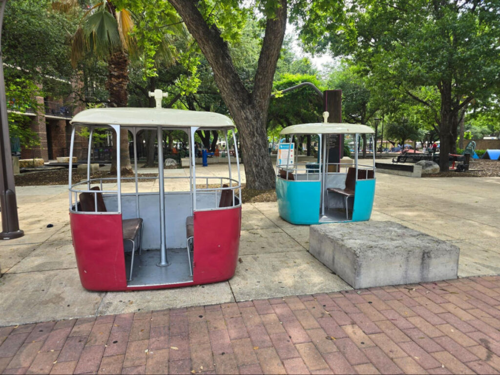 Gondolas sitting in Hemifair in front of Yanaguana Garden