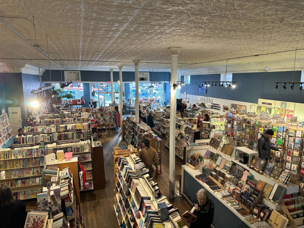 View of book shelves with books from the upper section of Highland Books