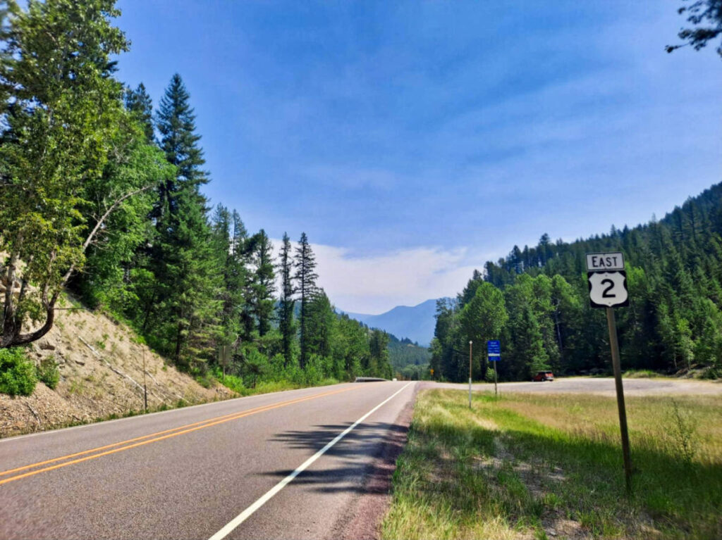 The signage of Highway 2 surrounded by greenery along the road