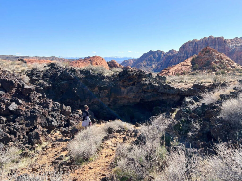 A woman hiking at the Snow Canyon State Park on a sunny day