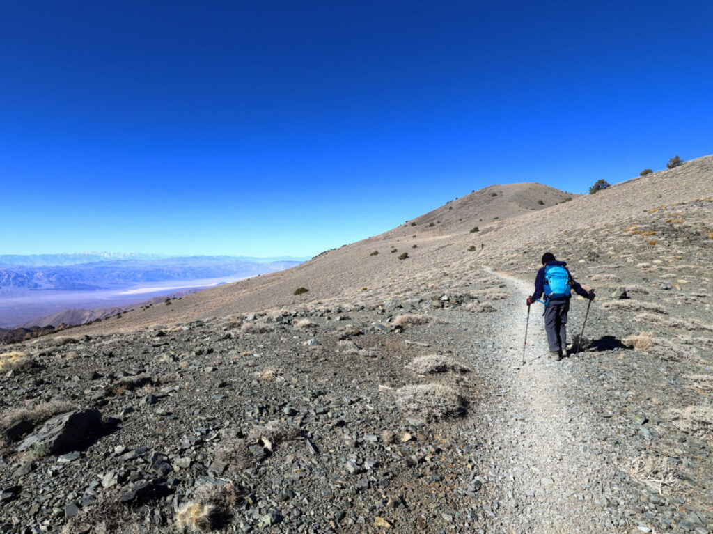 Person hiking on the Telescope Peak hiking trail, enroute to the summit