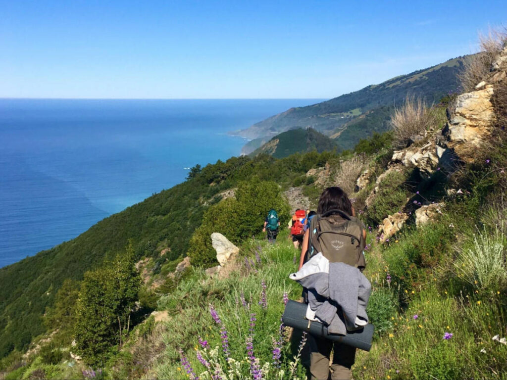 View of the hikers in Ventana Wilderness with an overlooking view of the Big Sur coastline
