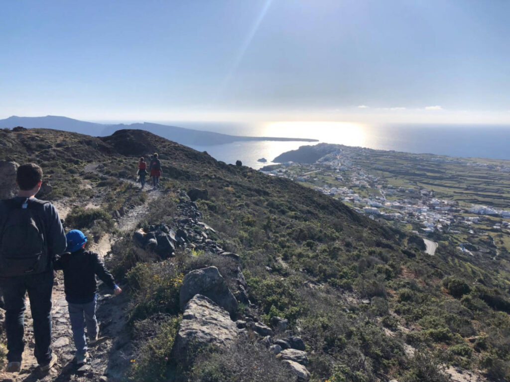 The hikers along the rocky terrain from Fira to Oia
