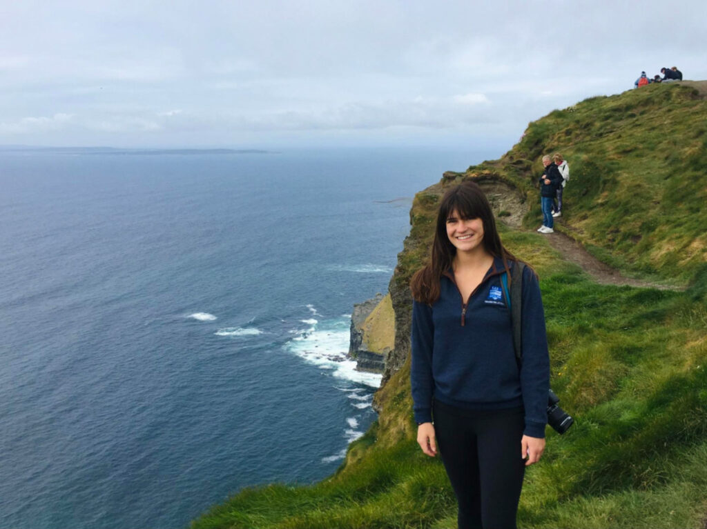 Travel Lemming writer Betty on a hill going to Cliffs of Moher