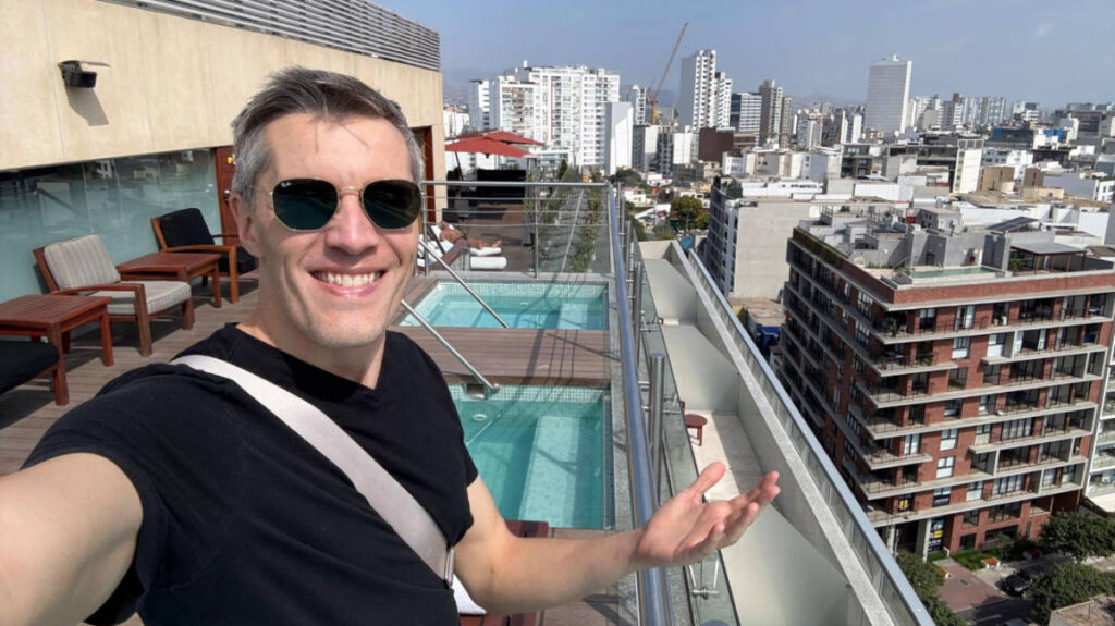 The author, Nate Hake smiling for a selfie at the rooftop of Hilton Lima Miraflores