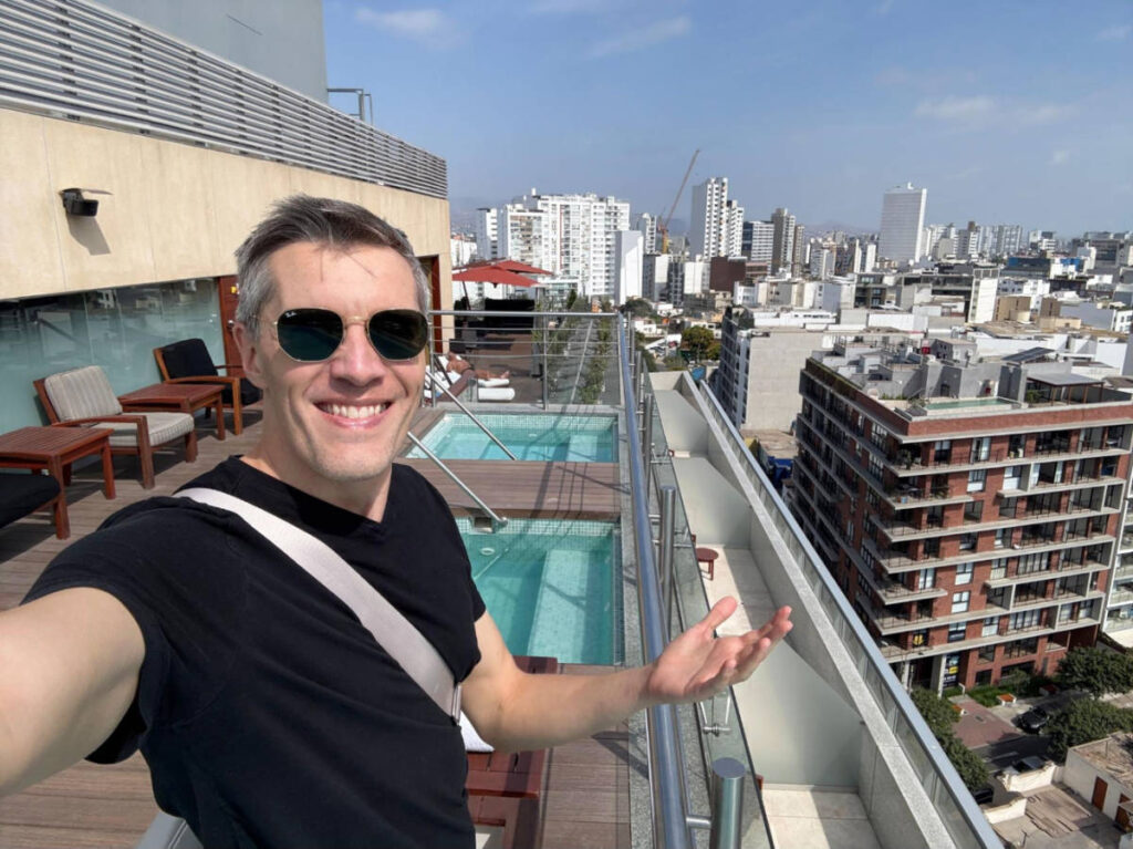 The author, Nate Hake smiling for a selfie at the rooftop of Hilton Lima Miraflores