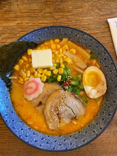 A bowl of spicy miso butter corn ramen in Hinodeya Ramen