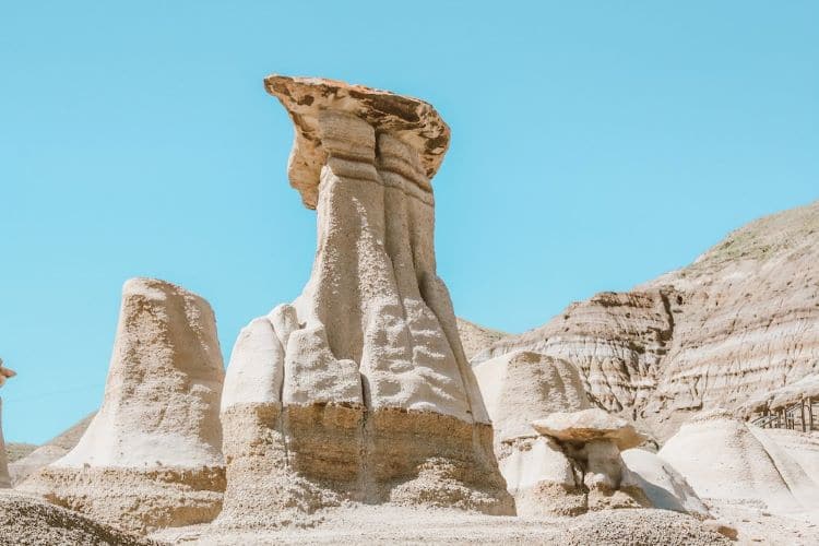 Hoodoos surrounded by rock and blue sky