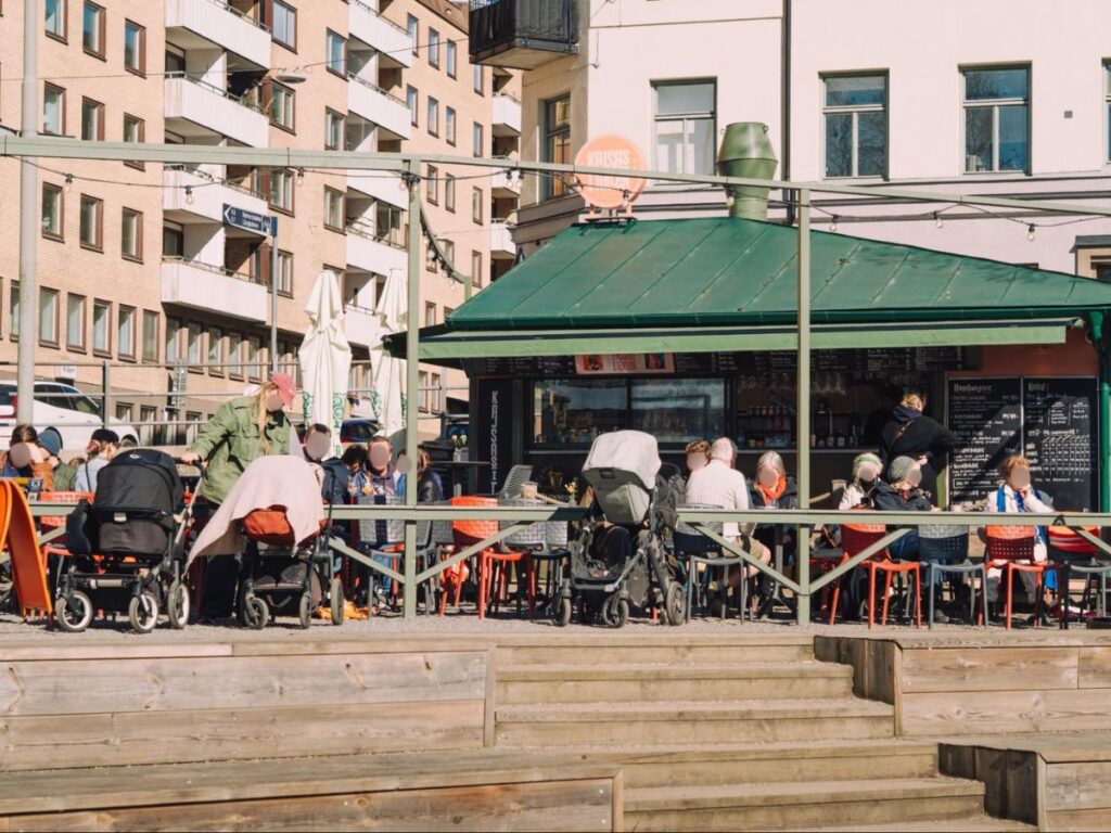 People relaxing at a café at the end of Hornstulls Strand