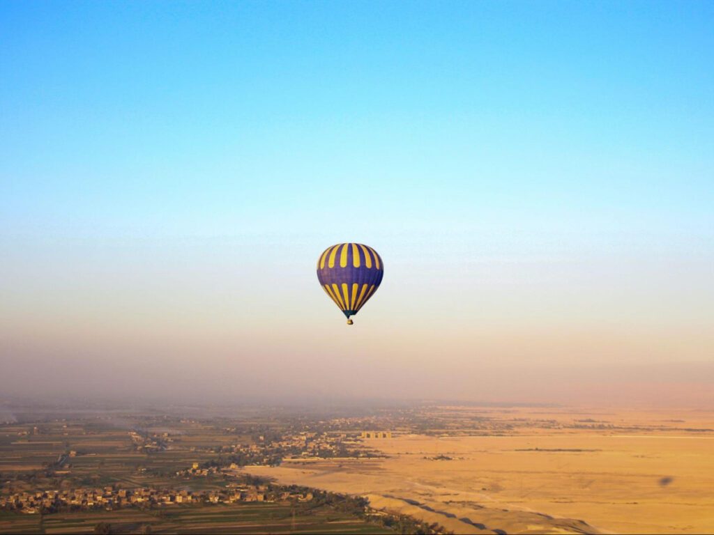 A hot air balloon flying over Egypt