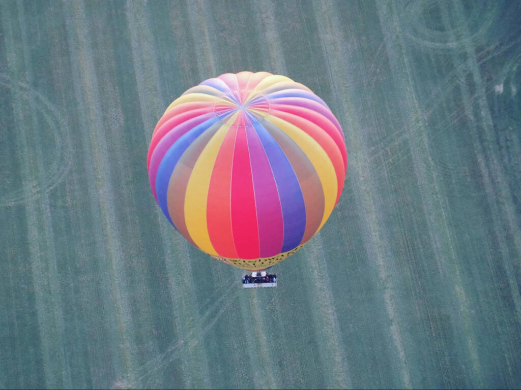 View of the hot air balloon flying over the Avon Valley