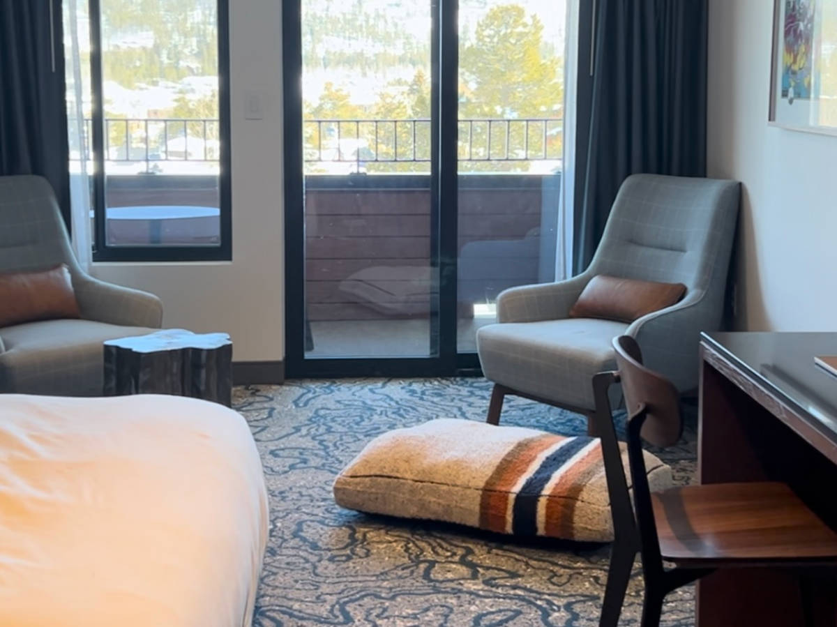 View of the balcony and the seating area in the room in Hotel Alpenrock