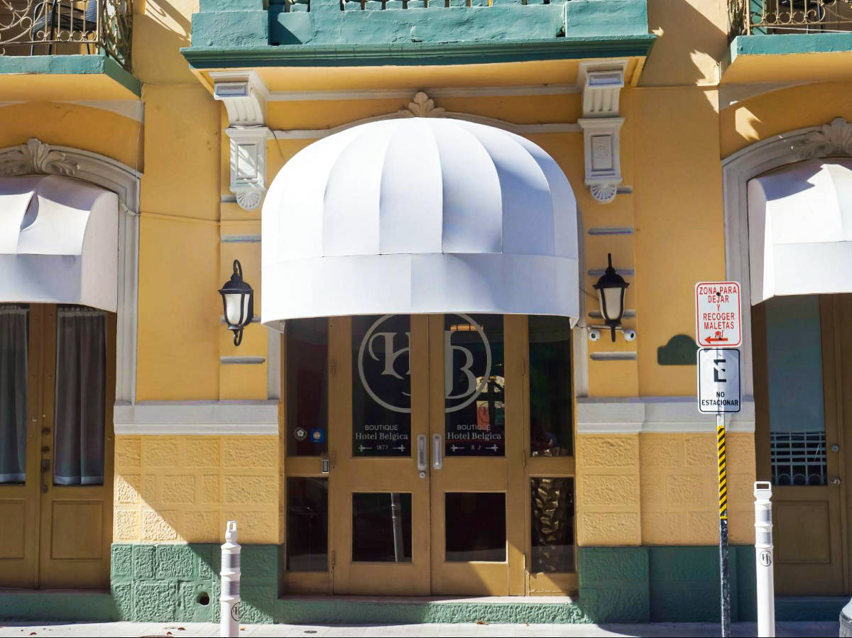 View of the facade and the entrance door of Hotel Belgica