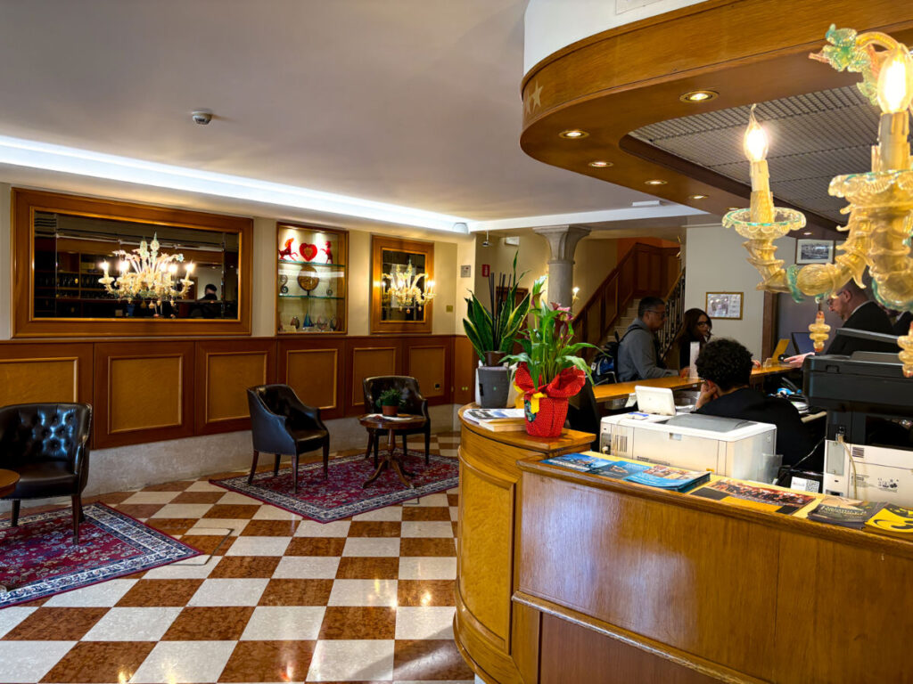 People checking in at the Hotel Rialto lobby