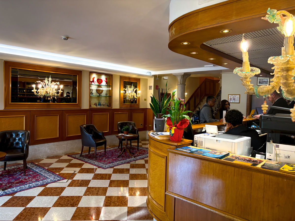 People checking in at the Hotel Rialto lobby