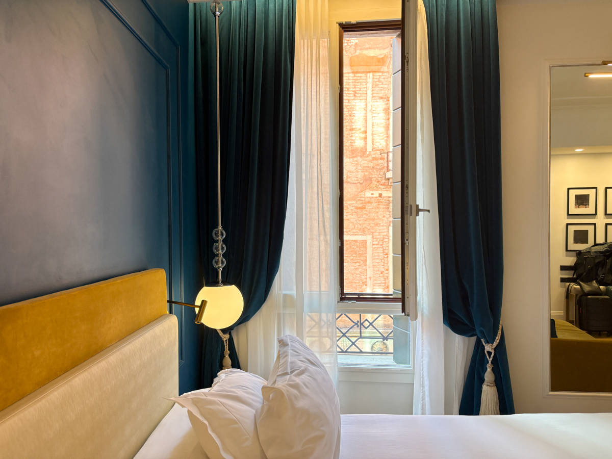 View of the brick walled alleyway from the window of the rotel room